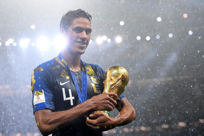 Raphael Varane poses with the World Cup after helping France win the 2018 tournament in Russia.