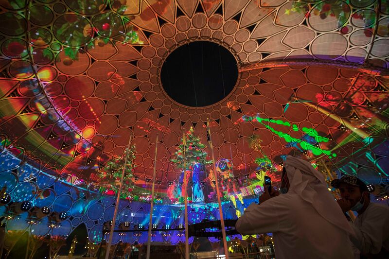 Expo 2020 Dubai's Al Wasl Dome lit up with Christmas projections. Leslie Pableo for The National