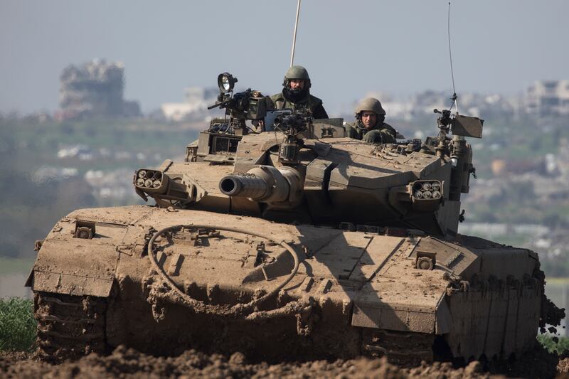 An Israeli tank moves along the border with Gaza in southern Israel. Getty Images