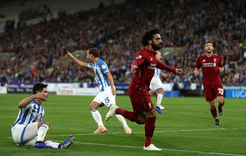 HUDDERSFIELD, ENGLAND - OCTOBER 20: Mohamed Salah of Liverpool(C) celebrates after scoring his sides first goal during the Premier League match between Huddersfield Town and Liverpool FC at John Smith's Stadium on October 20, 2018 in Huddersfield, United Kingdom. (Photo by Mark Robinson/Getty Images)