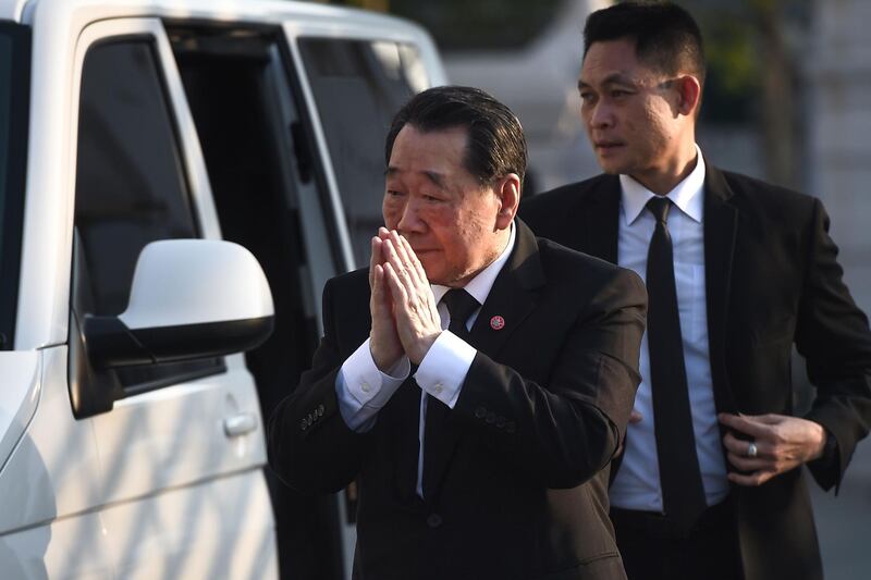 Thai business magnate and senior chairman of CP Group, Dhanin Chearavanont, arrives at the temple. AFP