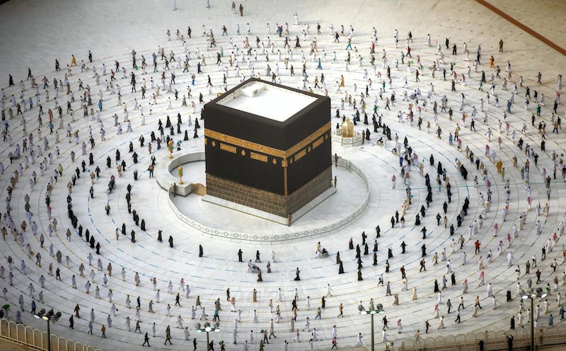 A handout picture provided by Saudi Ministry of Media on August 2, 2020 shows Muslim pilgrims circumambulating around the Kaaba, Islam's holiest shrine, at the centre of the Grand Mosque in the holy city of Mecca, while mask-clad and along specific pre-ordained rings as measures due to the COVID-19 coronavirus pandemic, on the final day of the annual Muslim Hajj pilgrimage. - Massive crowds in previous years triggered deadly stampedes during the ritual, but this year only up to 10,000 Muslims are taking part after millions of international pilgrims were barred because of the covid-19 pandemic crisis. (Photo by - / Saudi Ministry of Media / AFP) / === RESTRICTED TO EDITORIAL USE - MANDATORY CREDIT "AFP PHOTO / HO / SAUDI MINISTRY OF MEDIA" - NO MARKETING NO ADVERTISING CAMPAIGNS - DISTRIBUTED AS A SERVICE TO CLIENTS ===