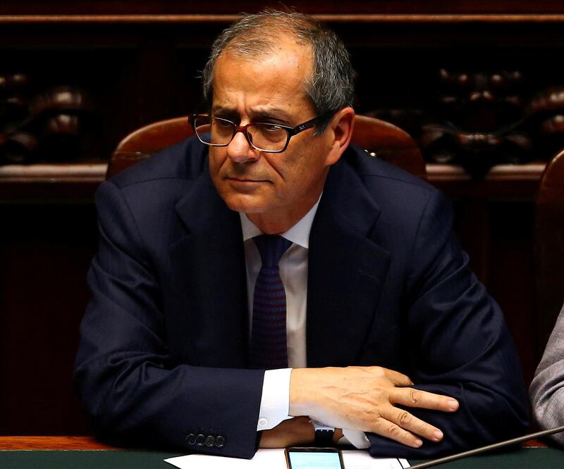 FILE PHOTO: Italian Economy Minister Giovanni Tria attends as Prime Minister Giuseppe Conte (unseen) speaks during his first session at the Lower House of the Parliament in Rome, Italy, June 6, 2018. REUTERS/Tony Gentile/File Photo