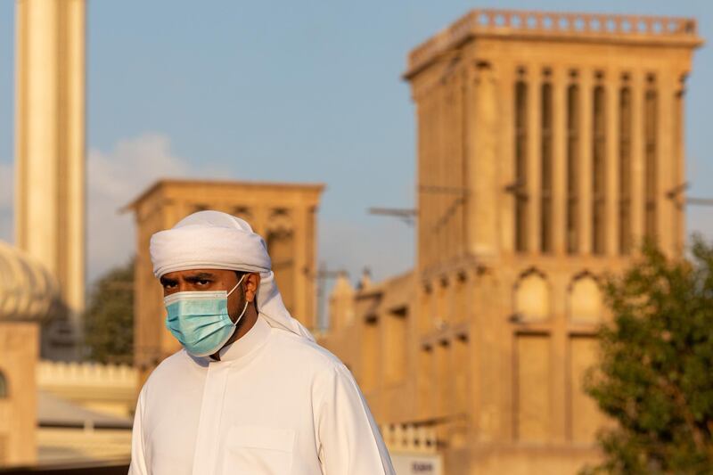 A pedestrian wearing a protective face mask walks through Al Fahidi historical neighborhood in old Dubai, United Arab Emirates, on Wednesday, Jan. 27, 2021.  Dubai replaced its top health official on Sunday after coronavirus cases in the United Arab Emirates, of which it is part, spiked in recent weeks. Photographer: Christopher Pike/Bloomberg