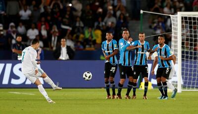 Soccer Football - FIFA Club World Cup Final - Real Madrid vs Gremio FBPA - Zayed Sports City Stadium, Abu Dhabi, United Arab Emirates - December 16, 2017   Real Madrid’s Cristiano Ronaldo scores their first goal from a free kick   REUTERS/Matthew Childs