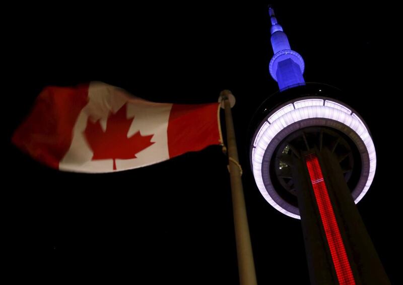 Toronto’s landmark CN Tower is lit blue, white and red – the colours of the French flag – following the Paris massacre. Canadian prime minister Justin Trudeau said on Friday it was too soon to say whether the deadly attacks in Paris would prompt him to reconsider his pledge to withdraw Canada from air strikes against ISIL militants in the Middle East. Reuters