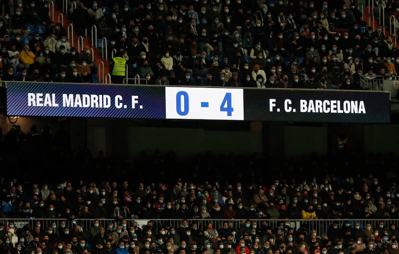 A scoreboard inside the Santiago Bernabeu shows the final result of the game between Real Madrid and Barcelona. Reuters