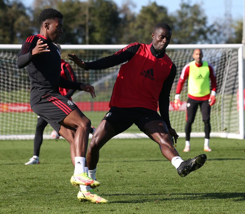 Amad and Eric Bailly of Manchester United in action during a first team training session at Carrington Training Ground. All photos by Getty Images