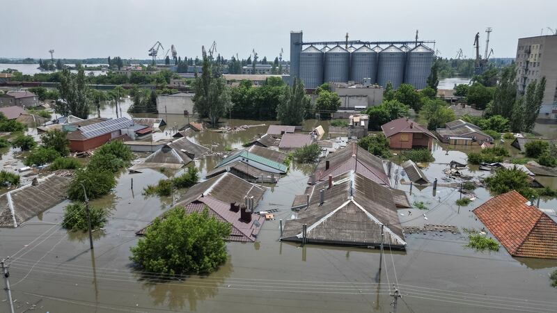 Floodwaters reach the rooftops of houses in Kherson. Reuters