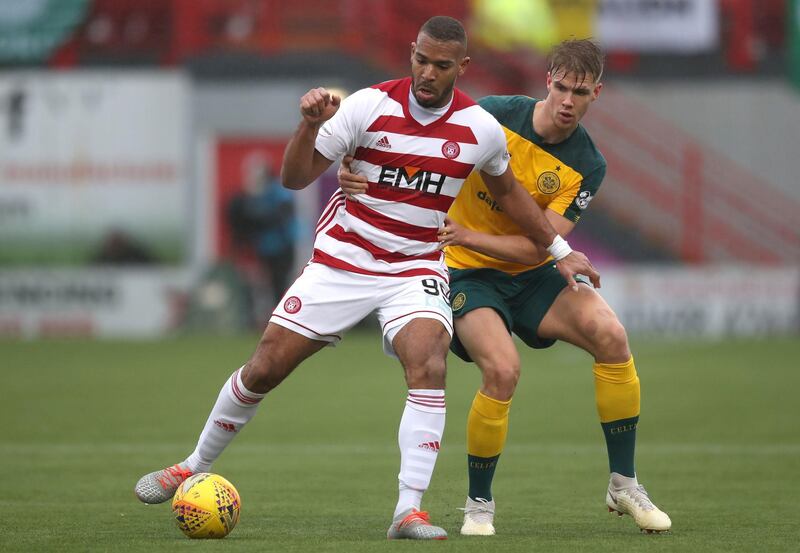 Hamilton Academical's Marios Ogkmpoe and Kristoffer Ajer of Celtic. PA