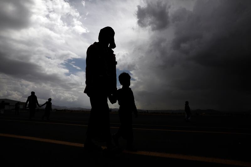 People walk towards Sanaa airport in Yemen during a prisoner exchange earlier this month. EPA