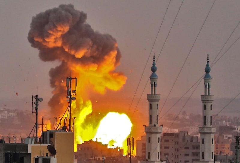 A picture taken on July 20, 2018 shows a fireball exploding in Gaza City during Israeli bombardment. Israeli aircraft and tanks hit targets across the Gaza Strip on July 20 after shots were fired at troops on the border, the army said, with Hamas reporting several members of its military wing killed in the latest flare-up in months of tensions. / AFP / BASHAR TALEB / ALTERNATIVE CROP
