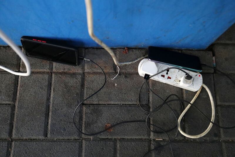 Dozens of residents from the nearby Al Barsha community are using sockets at the mall to charge their phones and to cool down