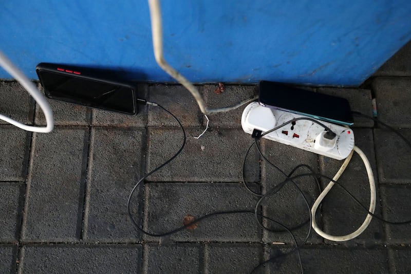 Dozens of residents from the nearby Al Barsha community are using sockets at the mall to charge their phones and to cool down