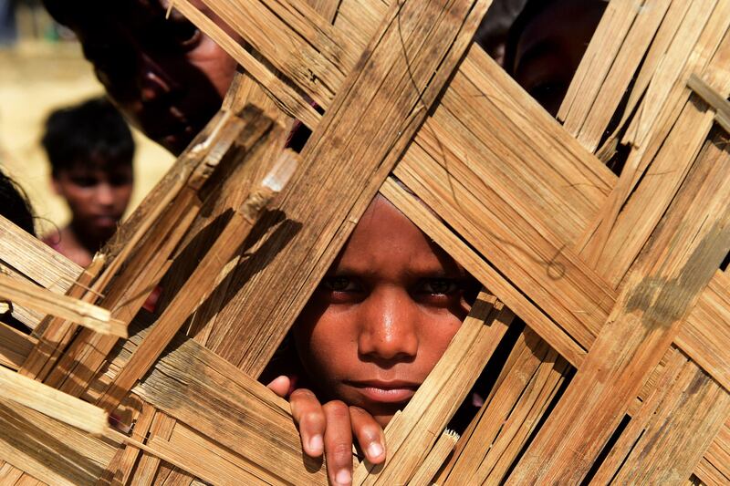 A Rohingya refugee child looks into a food distribution centre at Thankhali refugee camp in Bangladesh's Ukhia district.
Munir uz Zaman / AFP Photo