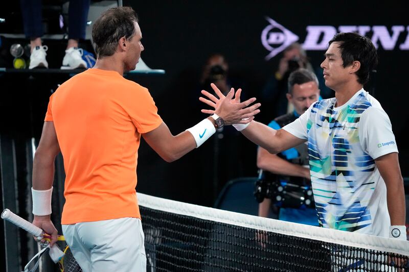 Rafael Nadal and Mackenzie McDonald greet at the net following their second round match at the Australian Open in Melbourne, Australia on January  18, 2023.  AP