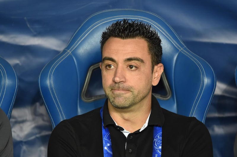 (FILES) A file photo taken on October 22, 2019 shows Al Sadd's Spanish coach Xavi Hernandez watching the second leg of the AFC Champions League semi-finals football match between Qatar's Al Sadd and Saudi' Al Hilal in Riyadh. Barcelona legend Xavi tested positive for COVID-19 in a statement released by Al Sadd football club on July 25, 2020. / AFP / Fayez Nureldine
