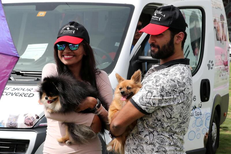 ABU DHABI , UNITED ARAB EMIRATES , APRIL 13   – 2018 :- People taking their photos with pets during the pet festival held at DU arena on Yas Island in Abu Dhabi. ( Pawan Singh / The National ) For News