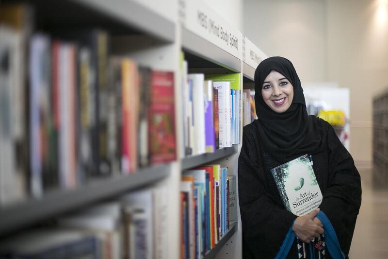 Eiman Al Zaabi holding her self-help book, which is launched tomorrow. Mona Al Marzooqi / The National
