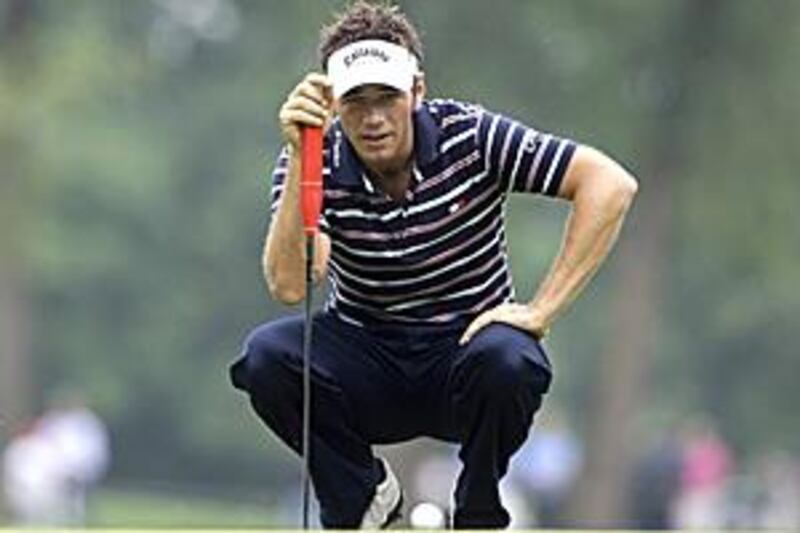 Nick Dougherty checks the green at the sixth hole during the final day of the International Golf Open in Moosinning-Eichenried.