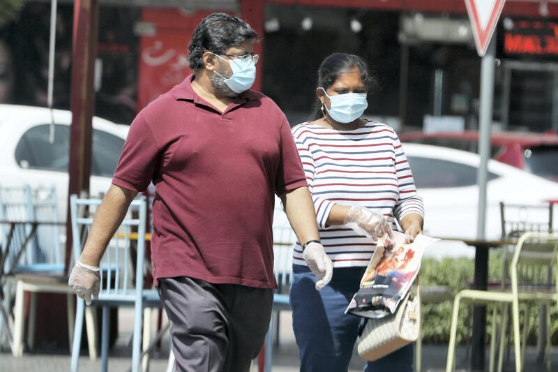 DUBAI, UNITED ARAB EMIRATES , October 3 – 2020 :- People wearing protective face mask and gloves as a preventive measure against the spread of coronavirus in Al Karama area in Dubai. (Pawan Singh / The National) For News/Stock/Online.