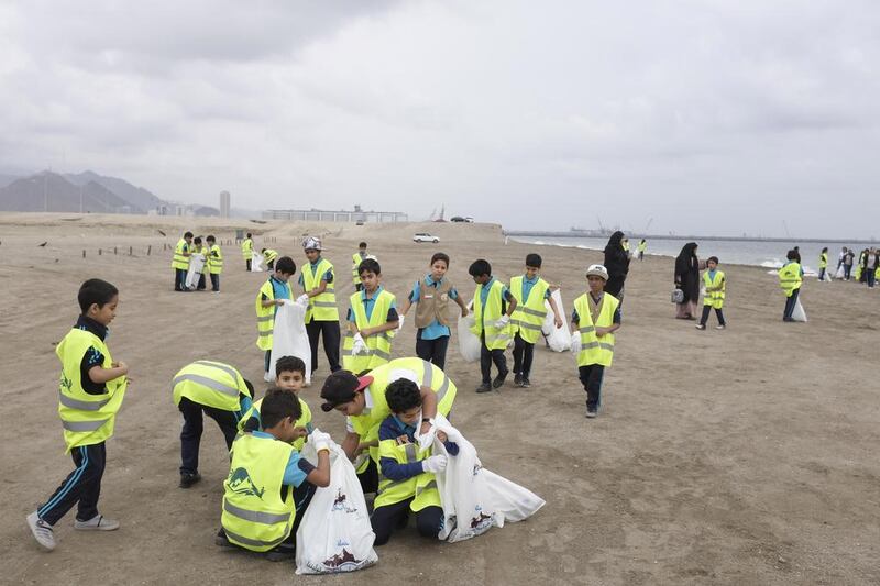 Pupils from Al Badiya School joined the beach cleaning campaign in Fujairah. Antonie Robertson / The National 