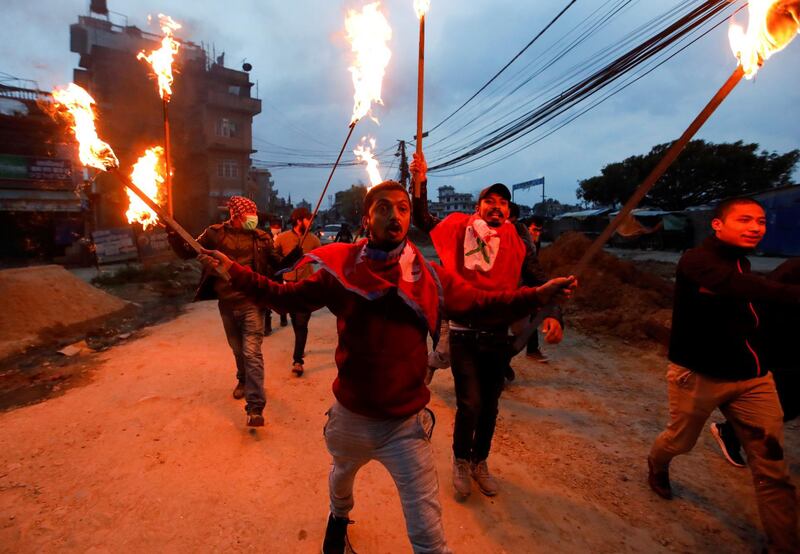 Students with torches protest against the alleged encroachment of the Nepal border by India in far west of Nepal. Reuters