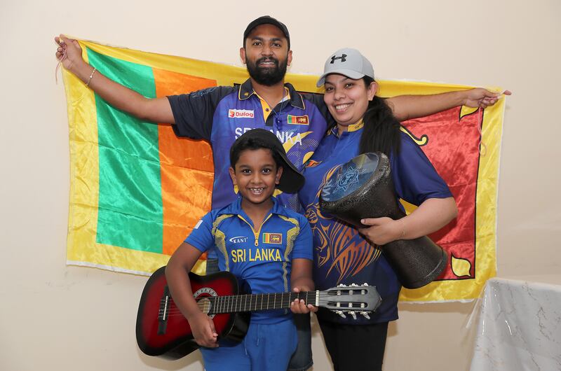 Dimantha Mark with his wife Natasha Perera and son Devin Mark, supporters of Sri Lankan cricket team with their musical instruments at their home in Sharjah. Pawan Singh/The National