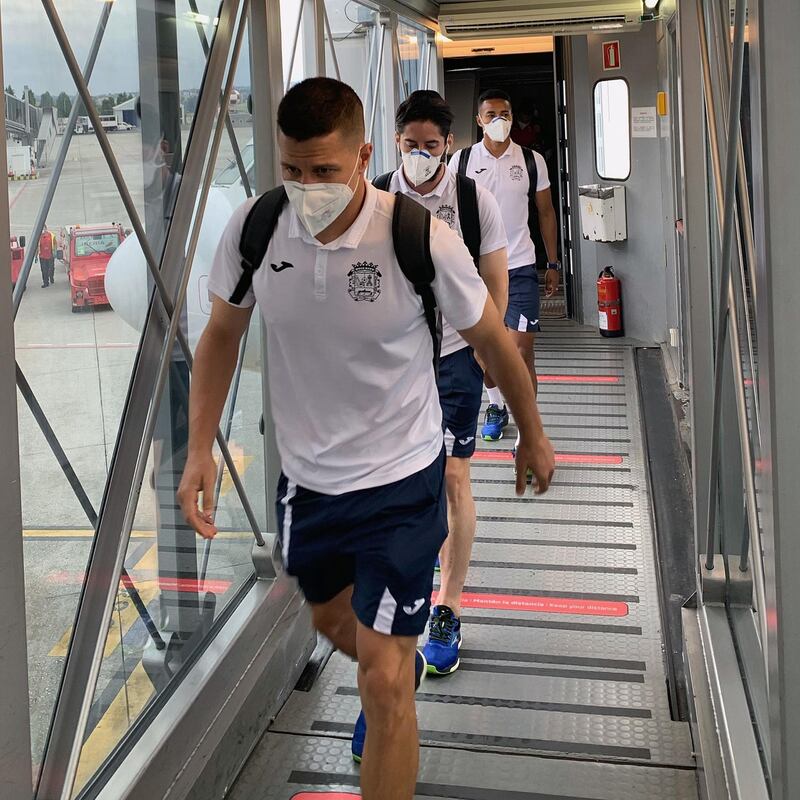 epa08558389 A handout photo made available by Spanish soccer team CF Fuenlabrada shows Fuenlabrada players arriving at the airport in A Coruna, Spain, 20 July 2020 (issued on 21 July 2020). The Spanish Second Division team Fuenlabrada's match against Deportivo Coruna was suspended after several of its players were tested positive for the COVID-19 disease.  EPA/CF FUENLABRADA / HO  HANDOUT EDITORIAL USE ONLY/NO SALES/NO ARCHIVES