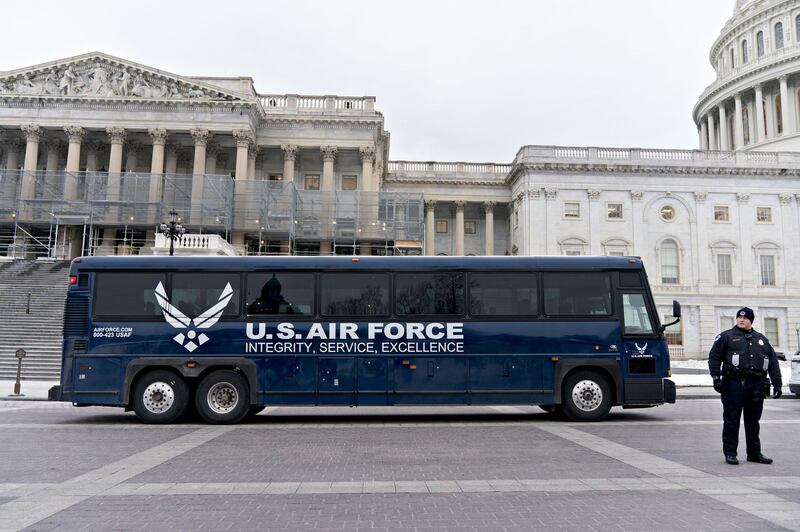 An Air Force bus intended to be used by members of Congress sits outside the U.S. Capitol in Washington, D.C., U.S., on Thursday, Jan. 17, 2019. President Donald Trump informed House Speaker Nancy Pelosi that he postponed a trip she planned to take to Belgium, Egypt and Afghanistan because of the partial government shutdown, telling her little more than an hour before her departure that she should stay in Washington to negotiate. Photographer: Andrew Harrer/Bloomberg