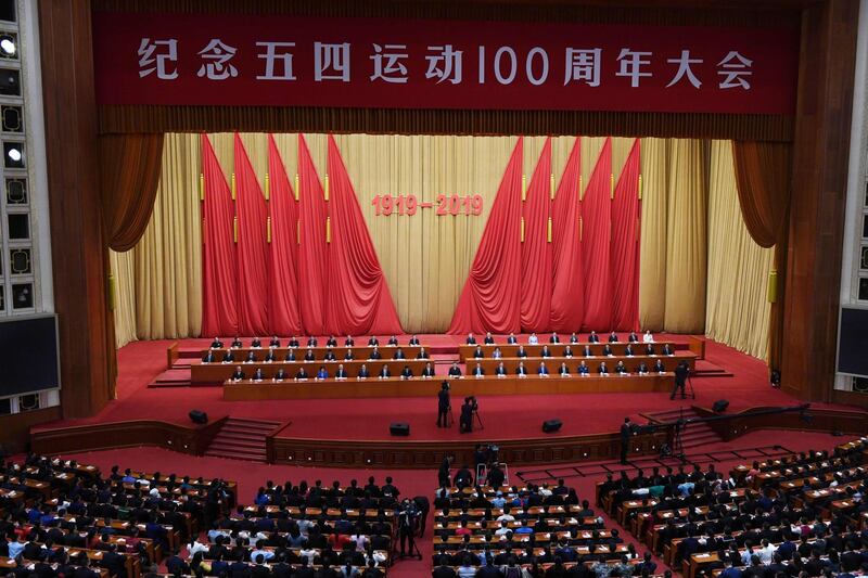 China's President Xi Jinping (C) speaks at a ceremony marking the centennial of the May Fourth Movement, a landmark student protest against colonialism and imperialism, in Beijing's Great Hall of the People on April 30, 2019. Xi Jinping exhorted China's youth on April 30 to obey the Communist Party as he marked the centennial of a student revolt, one of several sensitive anniversaries Beijing faces this year. / AFP / GREG BAKER

