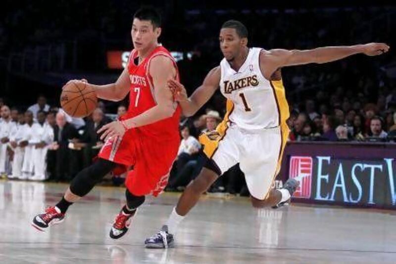 Jeremy Lin, right, and the Houston Rockets lost to the Los Angeles Lakers on Sunday.
. Alex Gallardo / Reuters