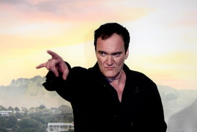 US director Quentin Tarantino gestures as he poses during a photocall ahead of the italian Premiere of Tarantino's latest movie "Once Upon A Time In Hollywood" in downtown Rome on August 2, 2019.  / AFP / Filippo MONTEFORTE
