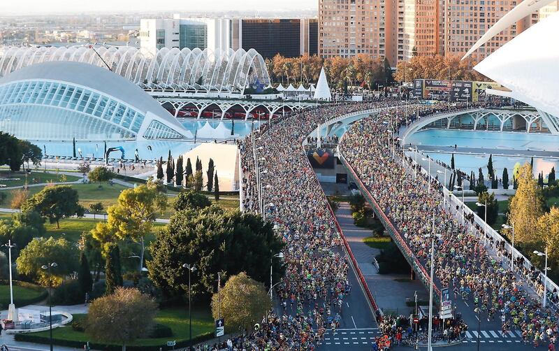Participants run across a bridge with the City of Arts and Sciences in the background at the start of the 2018 Valencia Trinidad Alfonso EDP Marathon in Spain. EPA