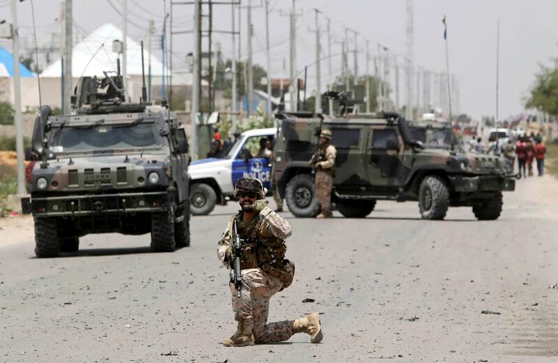 A soldier holds position as the damage is assessed after Islamist group al Shabaab hit a European Union armoured convoy in Mogadishu, Somalia October 1, 2018. REUTERS/Feisal Omar