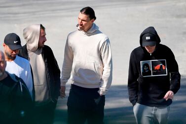 AC Milan's Swedish forward Zlatan Ibrahimovic (C) talks with fans as he leaves the Arsta IP training ground in Stockholm, on Apil 9, 2020 after participating in a training session of the Swedish footboll league club Hammarby's. Sweden OUT / AFP / TT NEWS AGENCY / TT News Agency