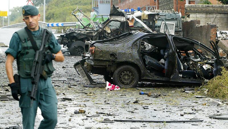 (FILES) In this file photo taken on August 24, 2007 civil guards inspect car bomb wreckage that exploded outside the barracks of Spain's paramilitary Guardia Civil in the northern town of Durango in the Basque region.
The Basque separatist group ETA apologised on April 20, 2018 for the "pain" and "harm" it caused during its decades-long campaign of violence, and appealed to its victims for forgiveness. The statement came just days before ETA is expected to announce its dissolution.



 / AFP PHOTO / Rafa RIVAS