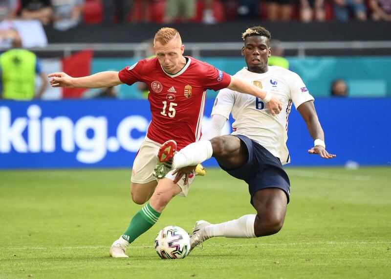 France midfielder Paul Pogba challenges Laszlo Kleinheisler of Hungary. Reuters