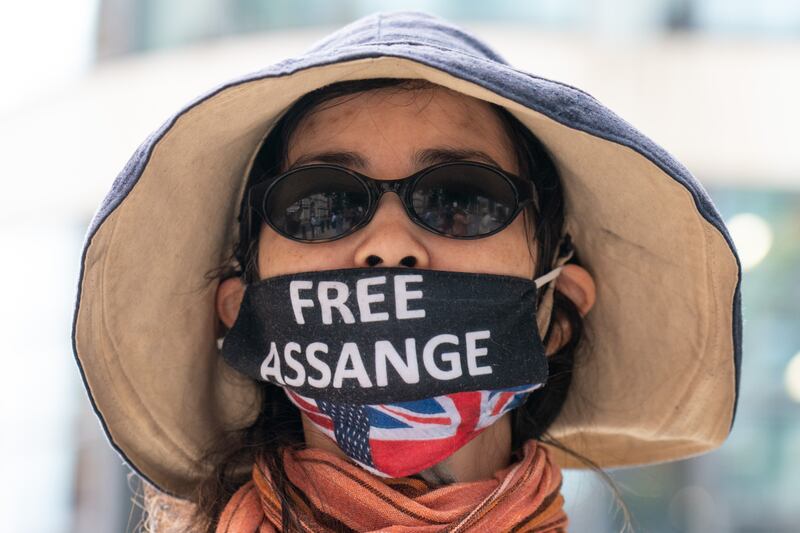Supporters of Wikileaks founder Julian Assange protest outside the Home Office in London a day before his birthday. PA