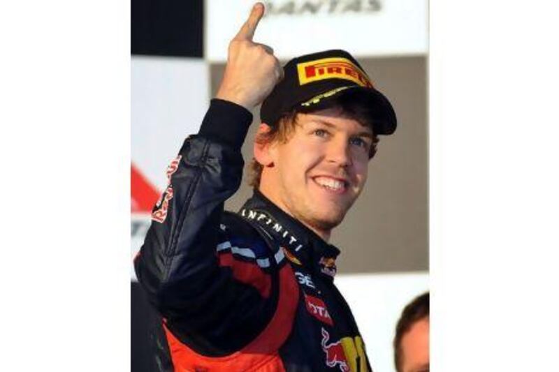 Sebastian Vettel celebrates his third grand prix victory in a row in Melbourne on Sunday. Joe Castro / EPA