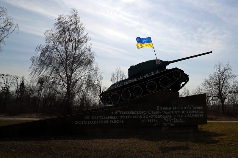 A Second World War monument with a Ukrainian flag reads 'Russian military boat, give up' in a village near Cherkasy, Ukraine, last March. EPA