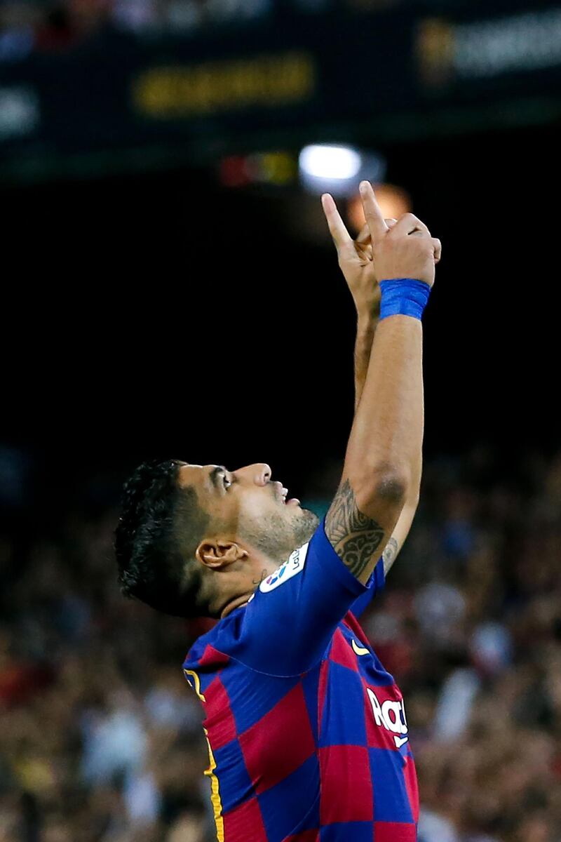 Barcelona's Uruguayan forward Luis Suarez celebrates after scoring a goal. AFP