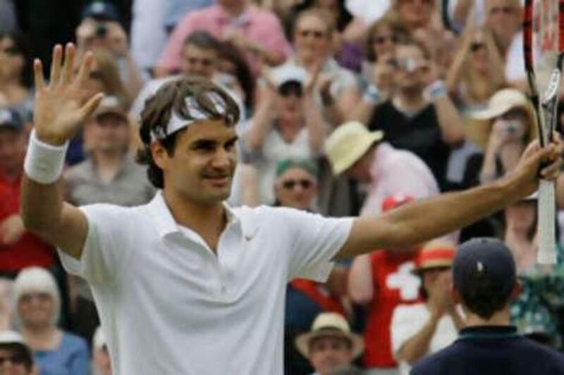Switzerland's Roger Federer celebrates his semifinal win over Russia's Marat Safin on the Centre Court at Wimbledon, Friday, July 4 , 2008. (AP Photo/Anja Niedringhaus) *** Local Caption ***  XWIM161_Britain_Wimbledon_Tennis.jpg