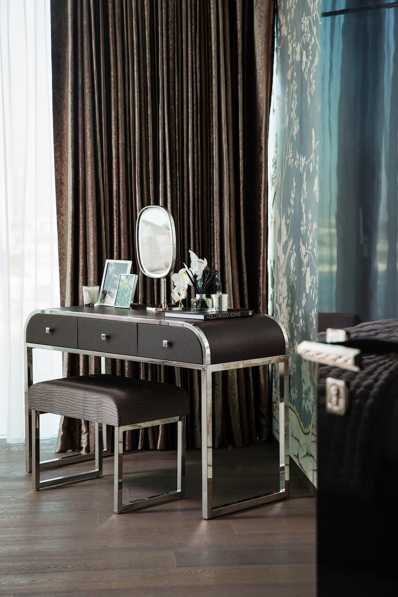 A dressing area in the new One Palm show apartment. It's clear that exterior views have influenced the interior colour palette in the One Palm show apartment, which draws on aquas, blues, neutrals and soft silver greys.