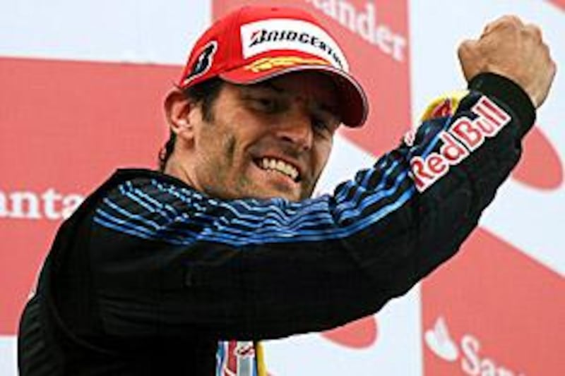 Red Bull's Mark Webber celebrates on the podium after winning the German Grand Prix.