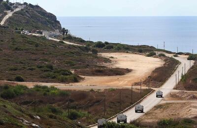 A United Nations peacekeeping force (UNIFIL) convoy advances towards the last checkpoint for the Lebanese army in the southernmost area of Naqura, by the border with Israel, on October 13, 2020. Lebanon and Israel, which are still technically at war, had agreed to begin UN-brokered negotiations on October 14 over the shared frontier, a particularly sensitive issue as Lebanon wants to drill for hydrocarbons in a part of the Mediterranean disputed by Israel. / AFP / Mahmoud ZAYYAT
