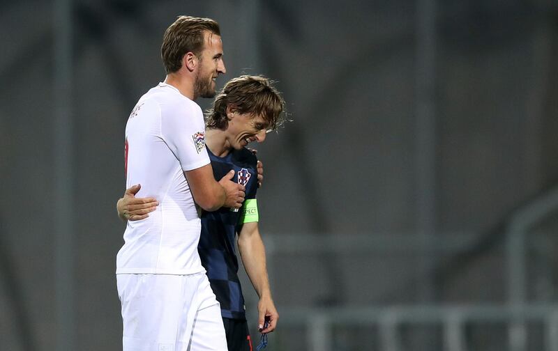 England forward Harry Kane, left, talks with Croatia midfielder Luka Modric. AFP