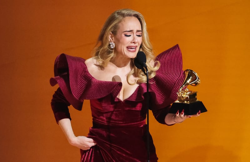 Adele accepts the award for the Best Pop Solo Performance for Easy on Me. Reuters
