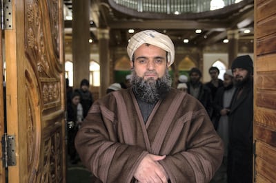 Mullah Fazel Karim Saraji stands outside his mosque in Kabul. He says climate change activism is his responsibilty. As part of his job, he oversees about 7,000 mosques in the country and encourages mullahs to include environmental messages in their sermons. 