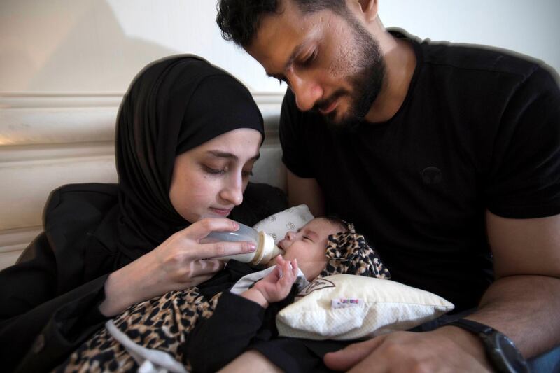 Sharjah, United  Arab Emirates -Mohammed with baby Malak who has been diagnosed with a rate muscle wasting disease.  The family need 8 Million to be able to provide Malak with the life saving medicines at their home in Sharjah.  Leslie Pableo for The National for Gillian's story